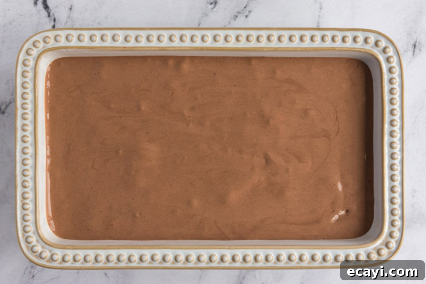 Decadent Homemade Chocolate Ice Cream 16 Freshly churned homemade chocolate ice cream mixture transferred to a loaf pan, covered, and ready for final freezing