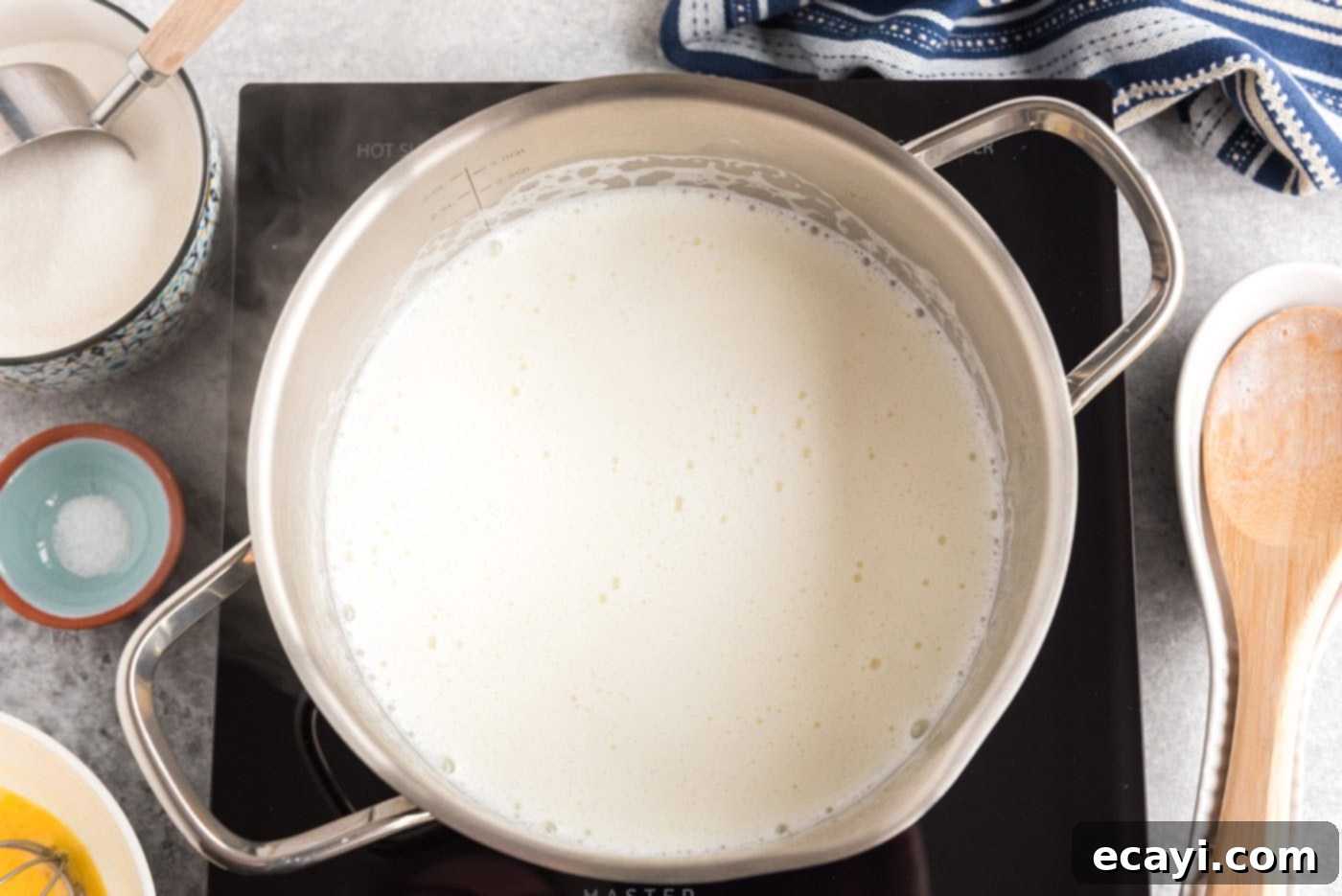 The Ultimate Homemade Vanilla Ice Cream 5 milk heated in a pot