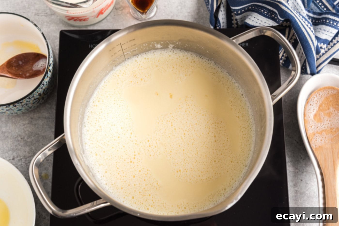 The Ultimate Homemade Vanilla Ice Cream 7 egg and milk mixture in a saucepan