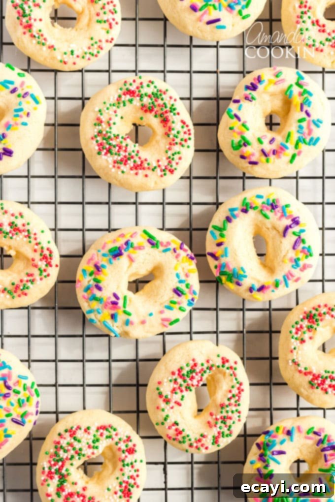 A delicious buttery sugar cookie with a pretty presentation. These soft cookies would be great for a birthday party, Cinco de Mayo celebrations, or just when you want a chewy sugar cookie. Mexican cookie rings on a wire rack