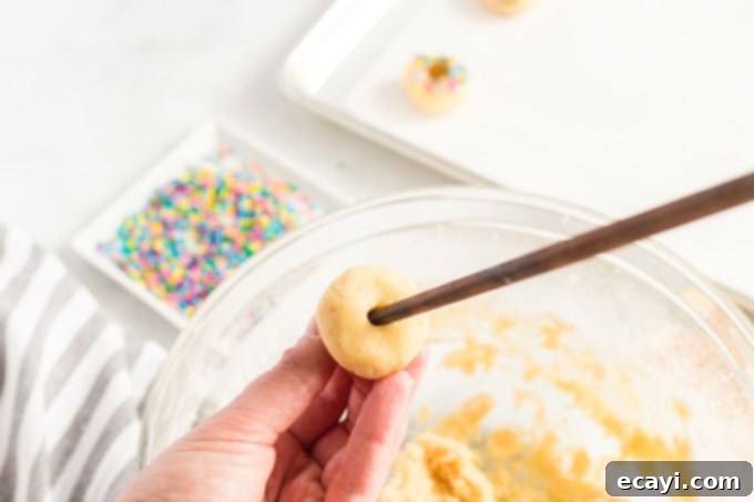Fiesta Cookies 5 inserting a skewer into a sugar cookie ball