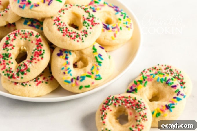 A delicious buttery sugar cookie with a pretty presentation. These soft cookies would be great for a birthday party, Cinco de Mayo celebrations, or just when you want a chewy sugar cookie. plate of mexican cookies