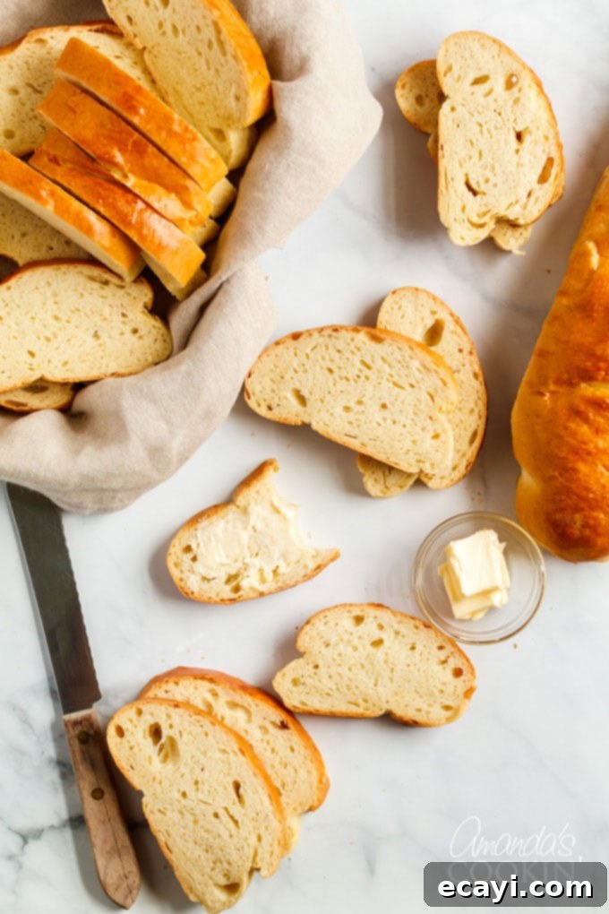 Rustic Italian Loaf 2 sliced italian bread on a marble counter