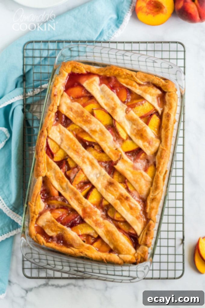 Heavenly Deep Dish Peach Pie 2 overhead view of golden-brown deep dish peach pie on cooling rack, invitingly warm