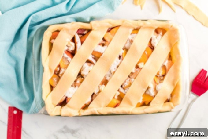 Heavenly Deep Dish Peach Pie 15 finished peach pie with a rustic crust, ready to be placed in the oven for baking