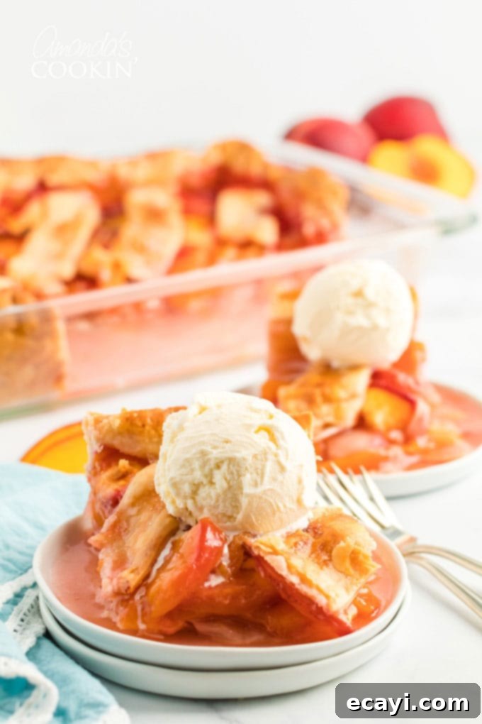 Heavenly Deep Dish Peach Pie 4 plate with a generous slice of warm peach pie topped with a scoop of melting vanilla ice cream
