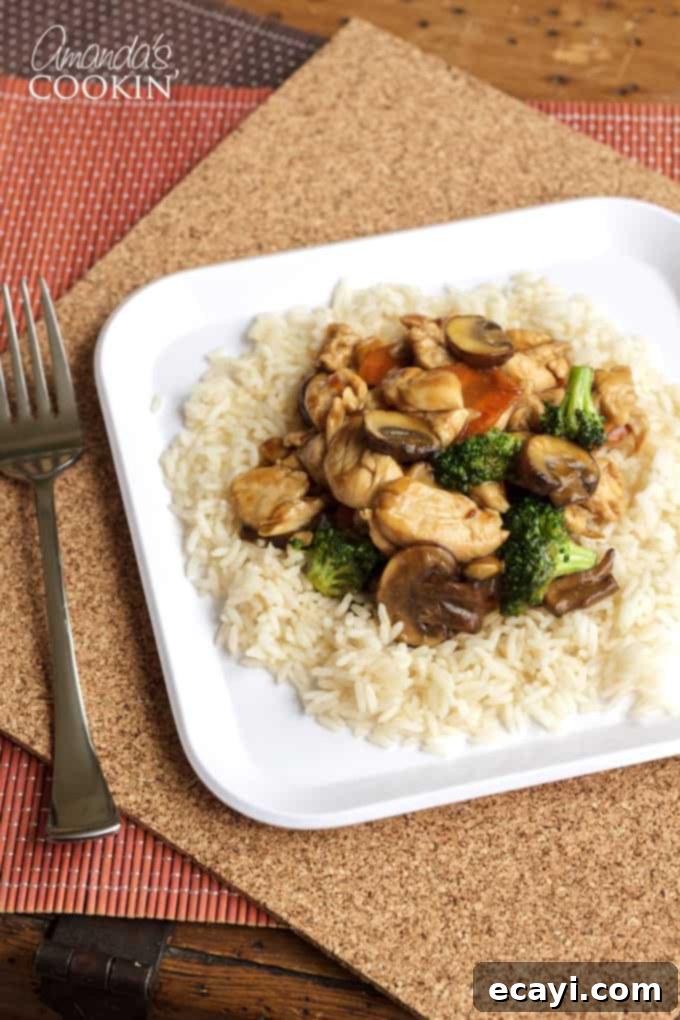 Silky Chicken and Mushroom Stir-Fry 3 Chicken stir fry on rice with broccoli and carrots