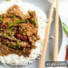 Khan's Caramel Beef 11 plate of mongolian beef with chop sticks