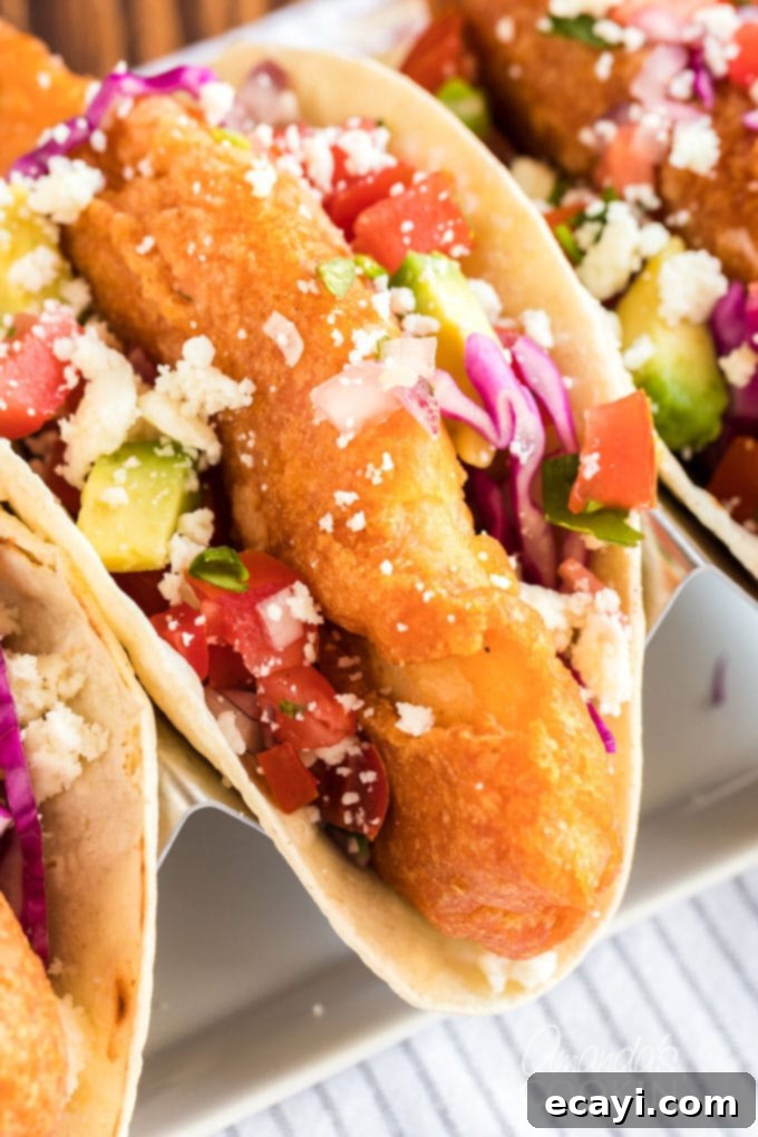 Your New Favorite Fish Tacos 2 fried fish in a taco shell, perfectly golden and inviting