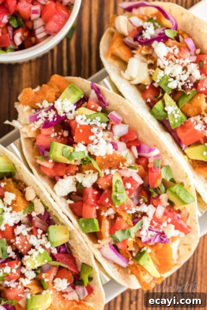 Your New Favorite Fish Tacos 3 overhead view of fish tacos with toppings arranged beautifully
