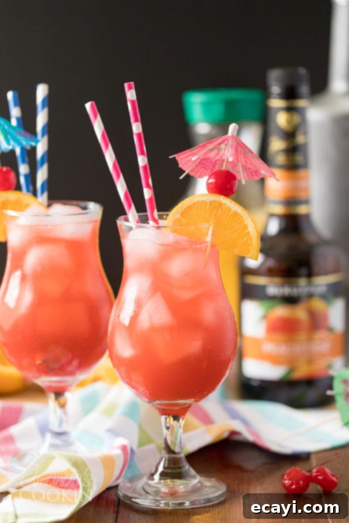 Seaside Seduction 2 sex on the beach cocktail in hurricane glass with straws