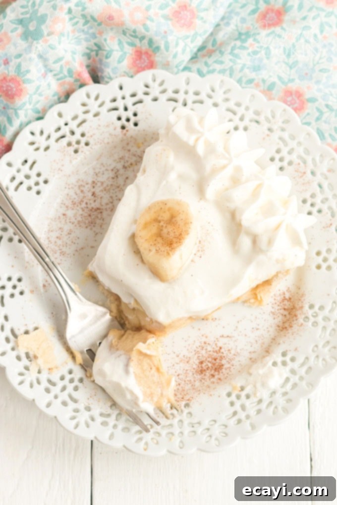 Golden Banana Indulgence 8 slice of banana cream pie with a fork on the plate