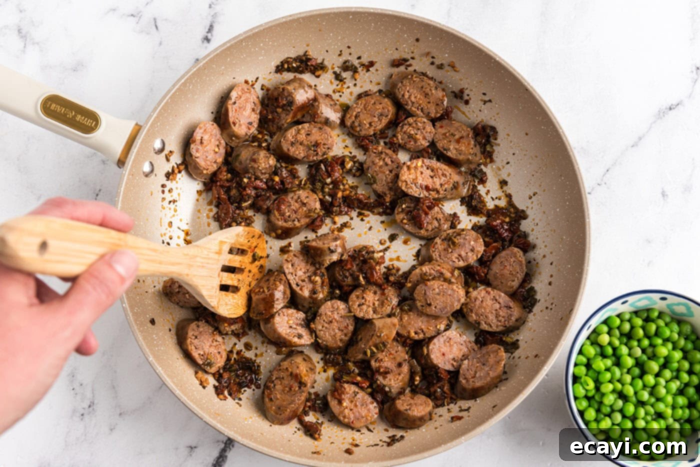 Hearty Sausage Penne With Peas 12 sliced Italian sausage added to skillet with sun dried tomato mixture