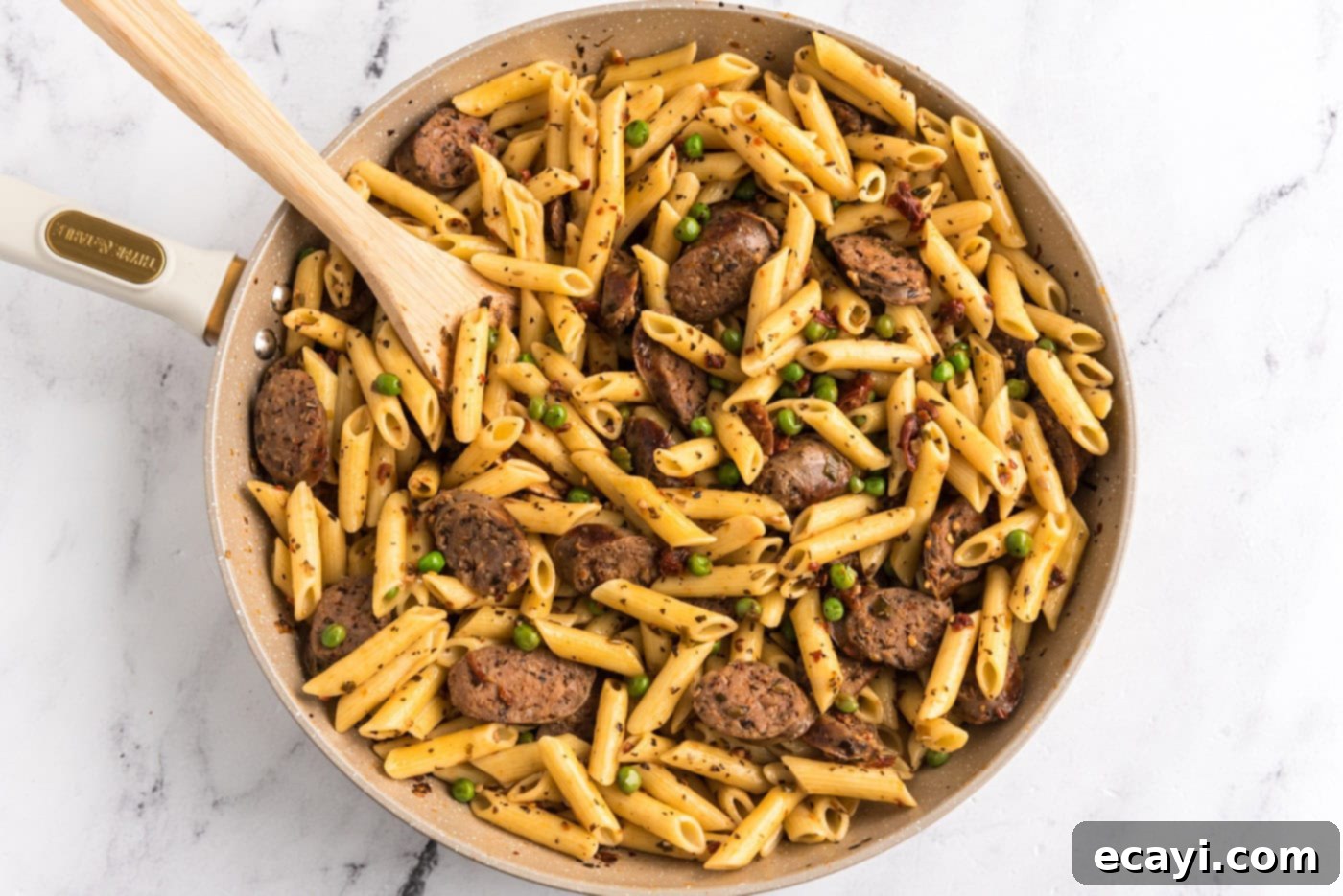 Hearty Sausage Penne With Peas 14 cooked penne pasta added to Italian sausage, peas, and sun dried tomato mixture
