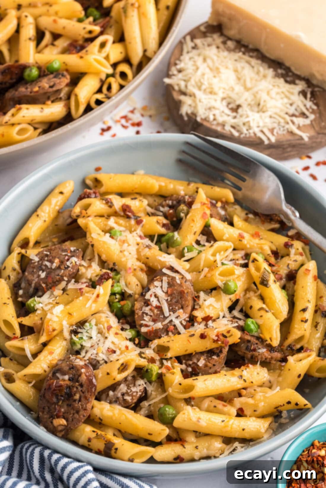 Hearty Sausage Penne With Peas 3 Bowl of Italian Sausage Penne & Peas pasta topped with shredded Parmesan cheese.