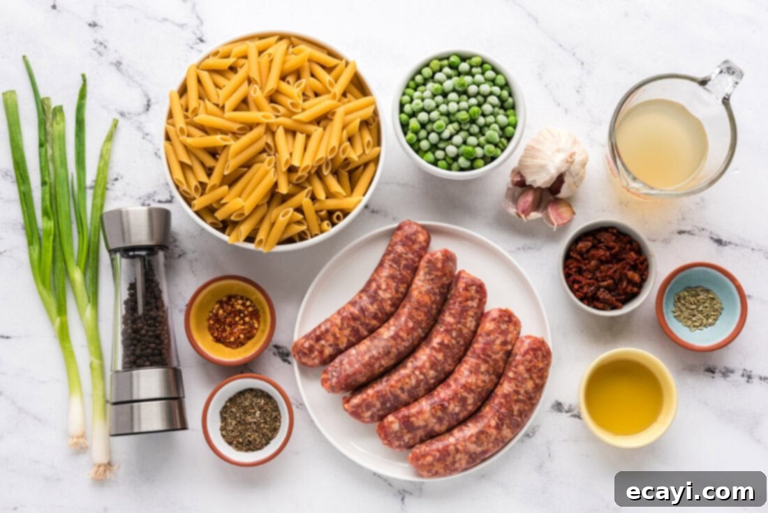 Hearty Sausage Penne With Peas 4 Ingredients for Sausage, Penne & Peas laid out on a kitchen counter.