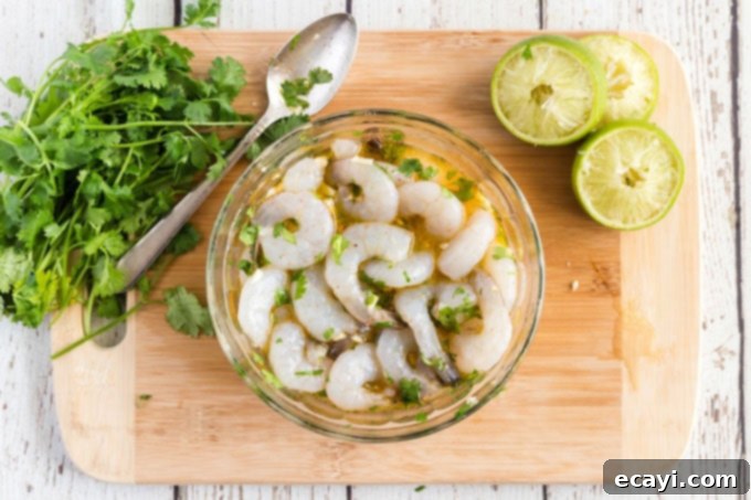 Smoky Grilled Shrimp 6 shrimp in marinade in bowl