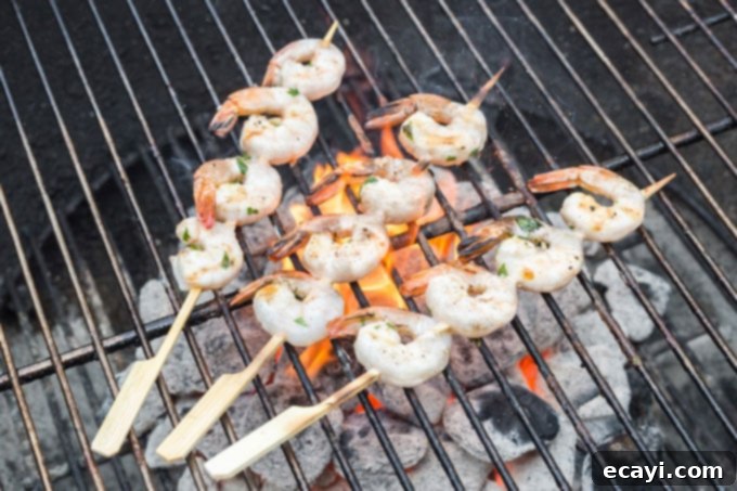 Smoky Grilled Shrimp 9 skewered shrimp on a charcoal grill