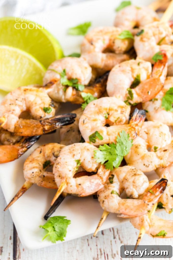 Smoky Grilled Shrimp 10 skewered shrimp on a plate