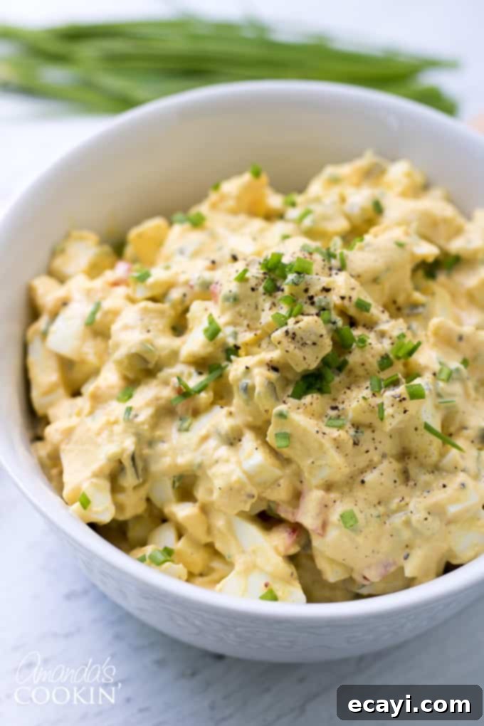 This Egg Salad is made up of all the classic ingredients from your traditional egg salad recipe. This is a great recipe for a potluck or BBQ! #easter #easterrecipes #eggsalad #BBQ #potluck #summer #summerrecipes #appetizers #lunch Delicious and creamy egg salad, a versatile classic for picnics and everyday meals