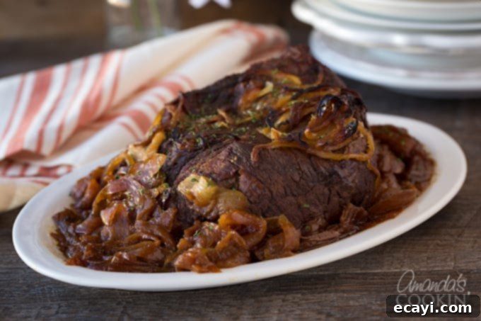 Traditional Amish Pot Roast 7 Serving a deliciously tender Amish Pot Roast with rich gravy, ready for a family dinner.