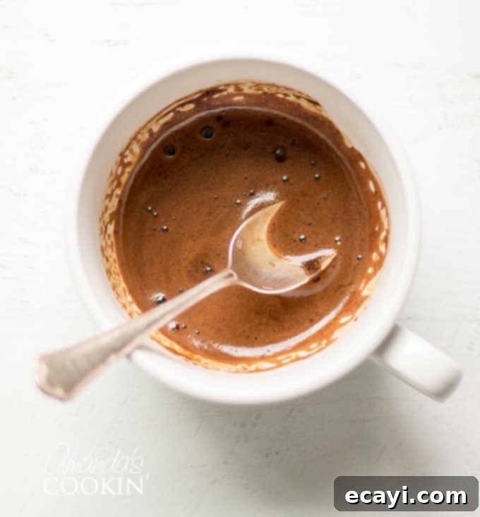 Decadent Tiramisu 6 A small cup of prepared espresso extract, ready to be used in the cake recipe.