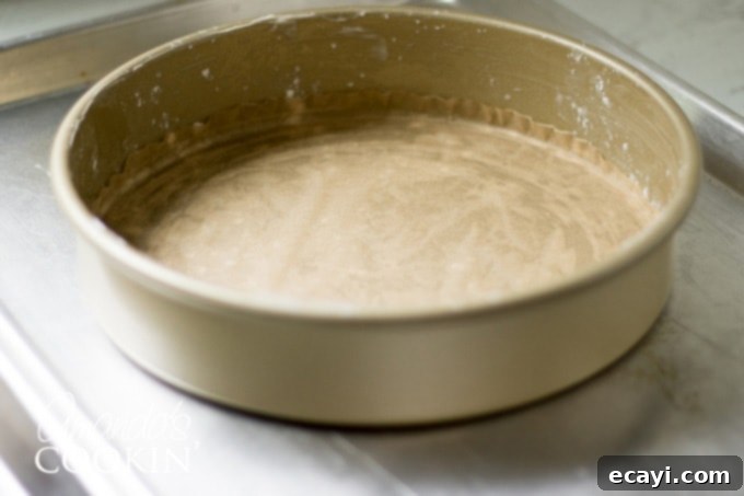 Decadent Tiramisu 3 A cake pan properly lined with parchment paper and buttered, ready for batter.