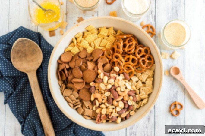 Savory Snack Medley 5 nuts, pretzels, cereal, and bagel chips in a bowl