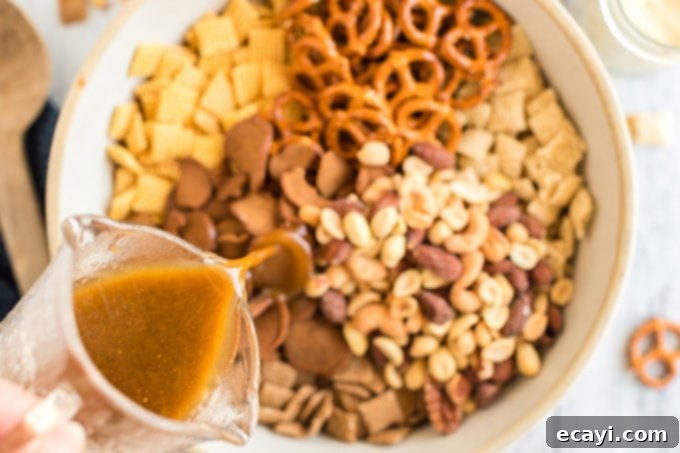 Savory Snack Medley 8 pouring sauce into bowl of snack foods