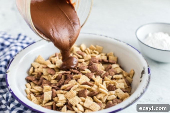 Peanut Butter Frost Bites 7 pouring chocolate into chex cereal