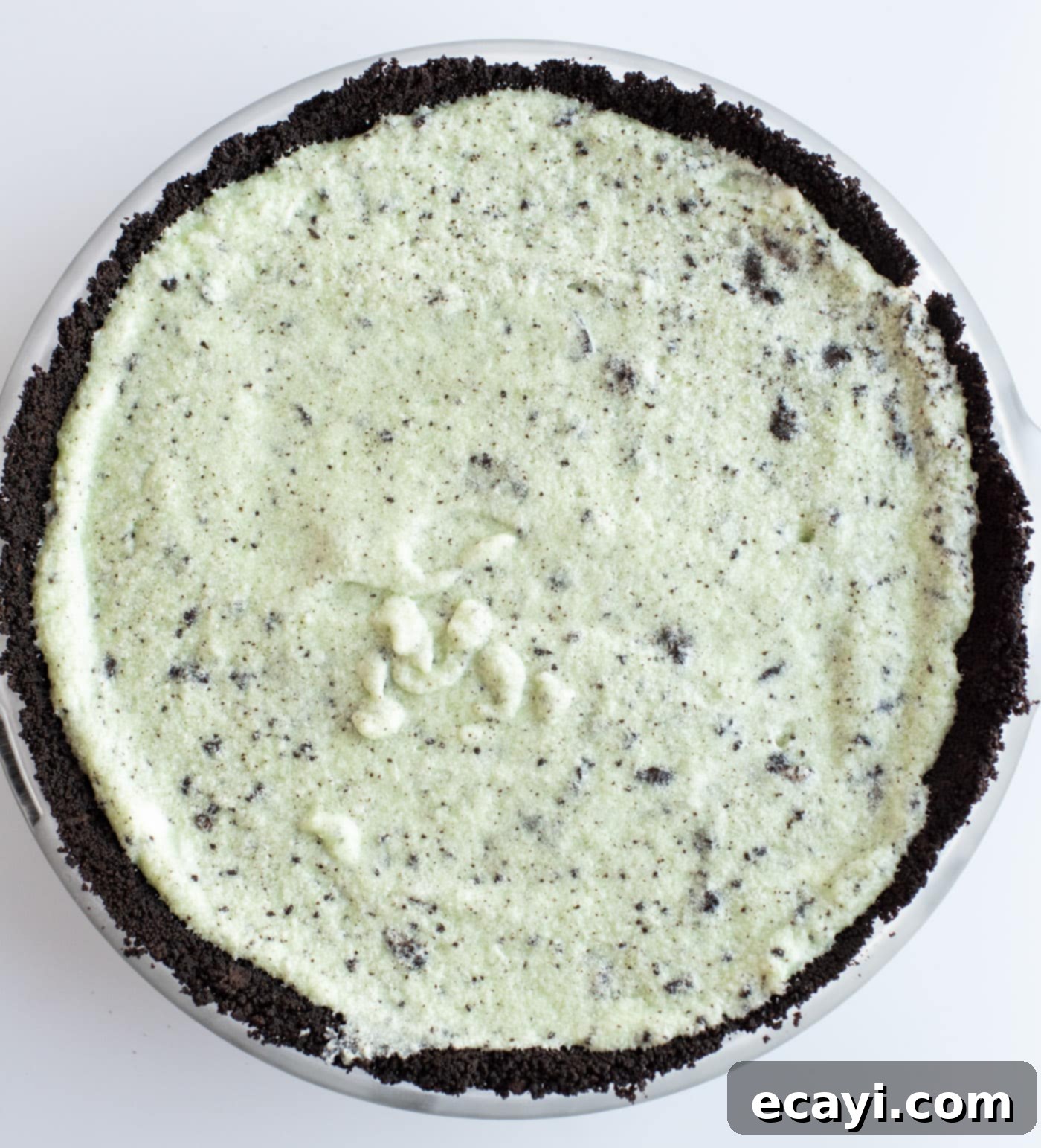 Decadent Grasshopper Pie 10 The completed Grasshopper Pie with its green filling and crushed Oreo topping, ready to be frozen and served.
