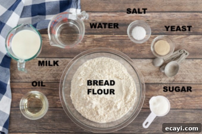 Amish Farmhouse White Loaf 2 Ingredients laid out for making homemade Amish white bread: water, milk, salt, sugar, oil, yeast, and bread flour.