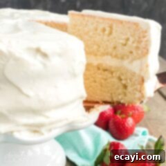 Timeless White Cake 11 slice of white cake being removed with spatula