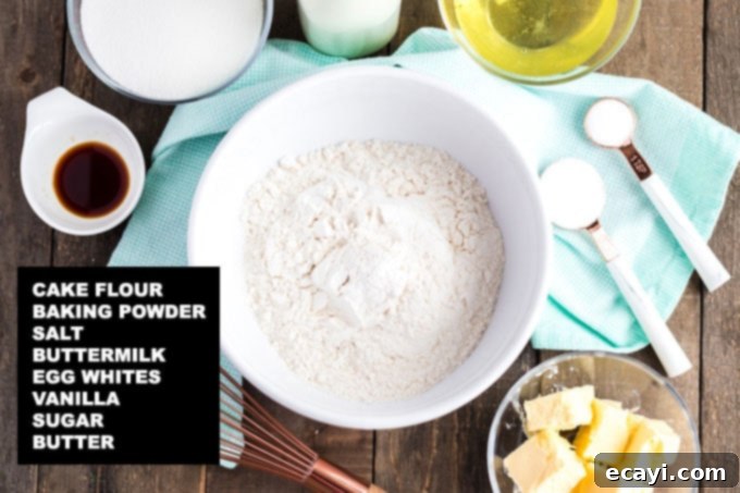 Timeless White Cake 2 labeled ingredients for white cake recipe: cake flour, baking powder, salt, buttermilk, egg whites, vanilla, sugar, butter