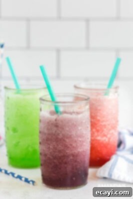 Kitchen Crafted Slush Floats 9 Three distinct slushie variations: a simple red slush, a layered slushie float with ice cream, and a blended creamy slushie float.