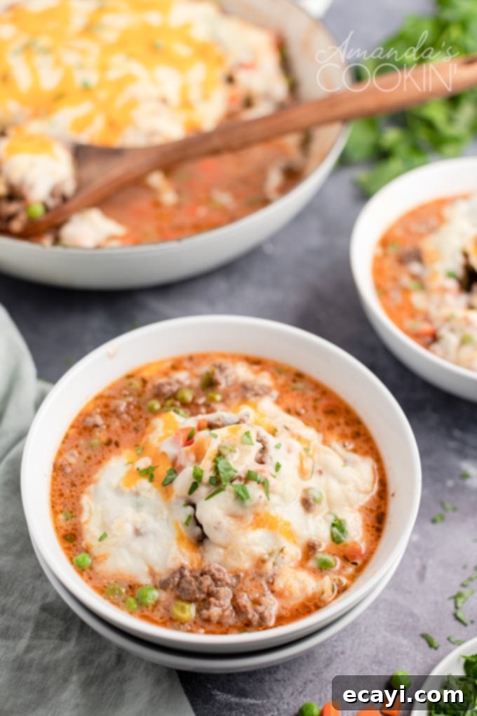 This Shepherd's Pie uses fresh ingredients mixed with ground beef to make a deliciously satisfying and filling dinner recipe! A bowl of delicious homemade Shepherd's Pie, ready to be enjoyed.