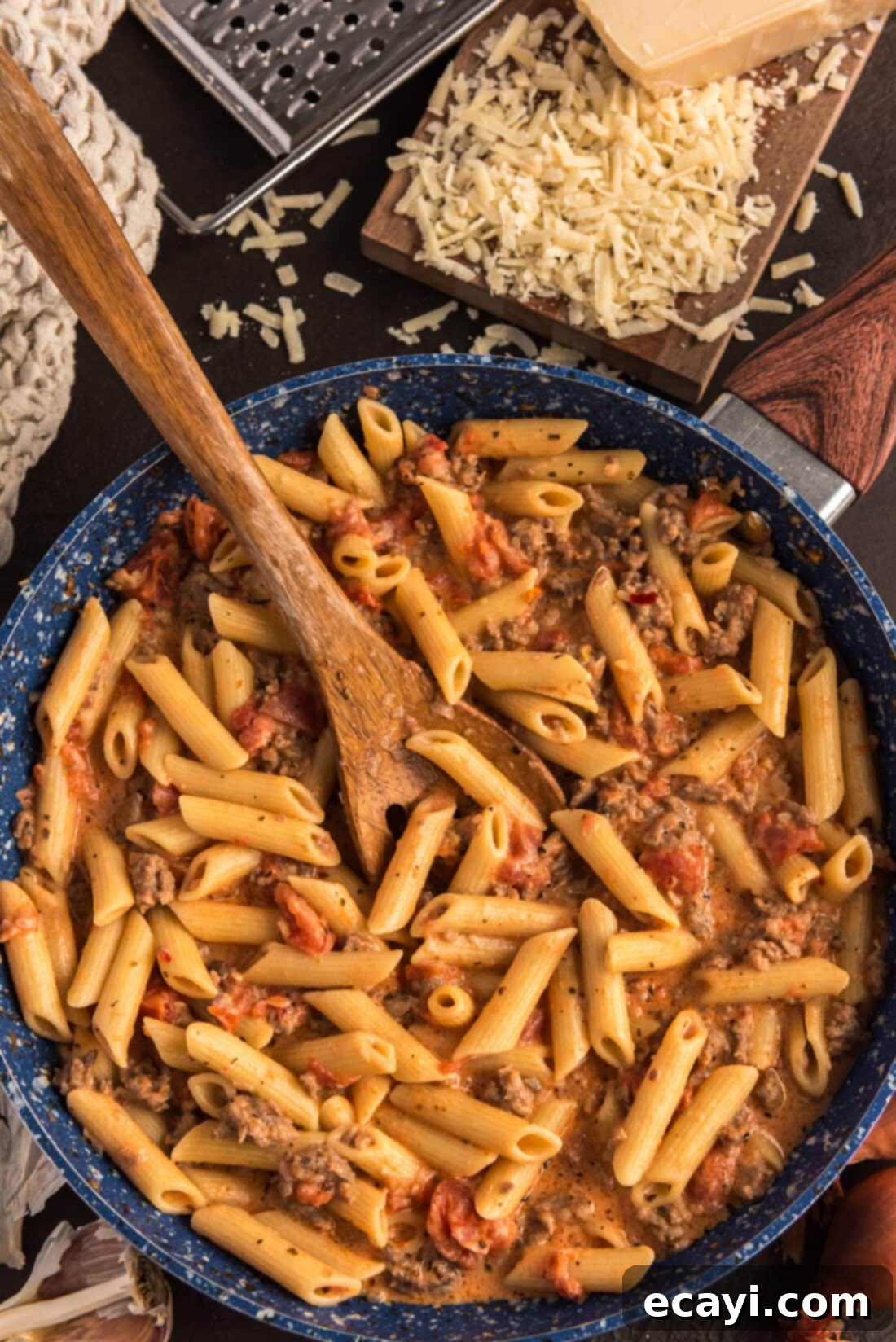 Tomato Sage Sausage Penne 2 Penne with Tomato Sage Sausage Sauce in a skillet with a spoon, ready to serve