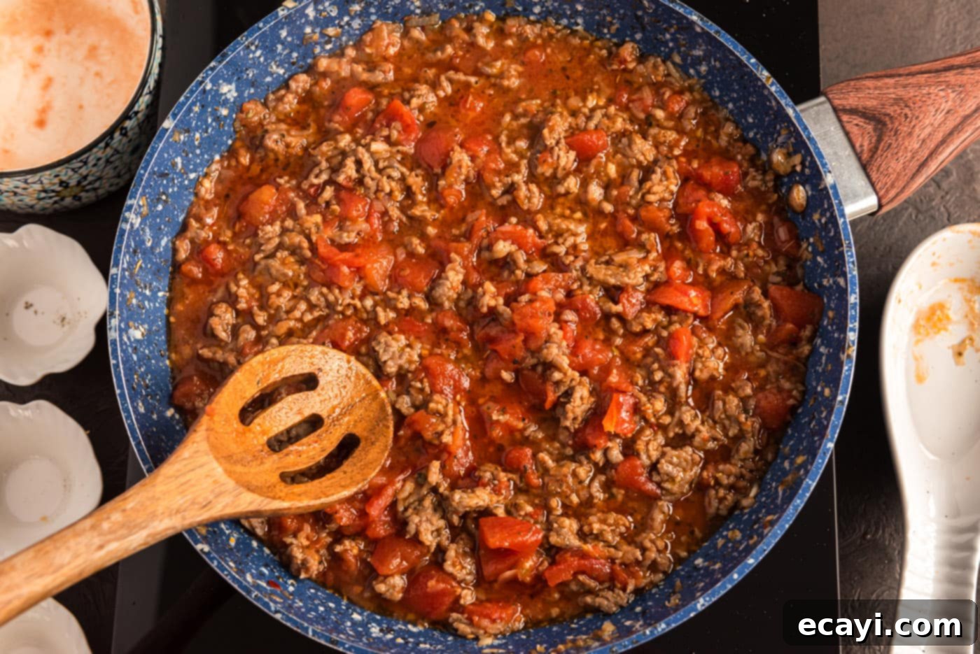 Tomato Sage Sausage Penne 9 ground sausage tomato sauce simmering in a skillet