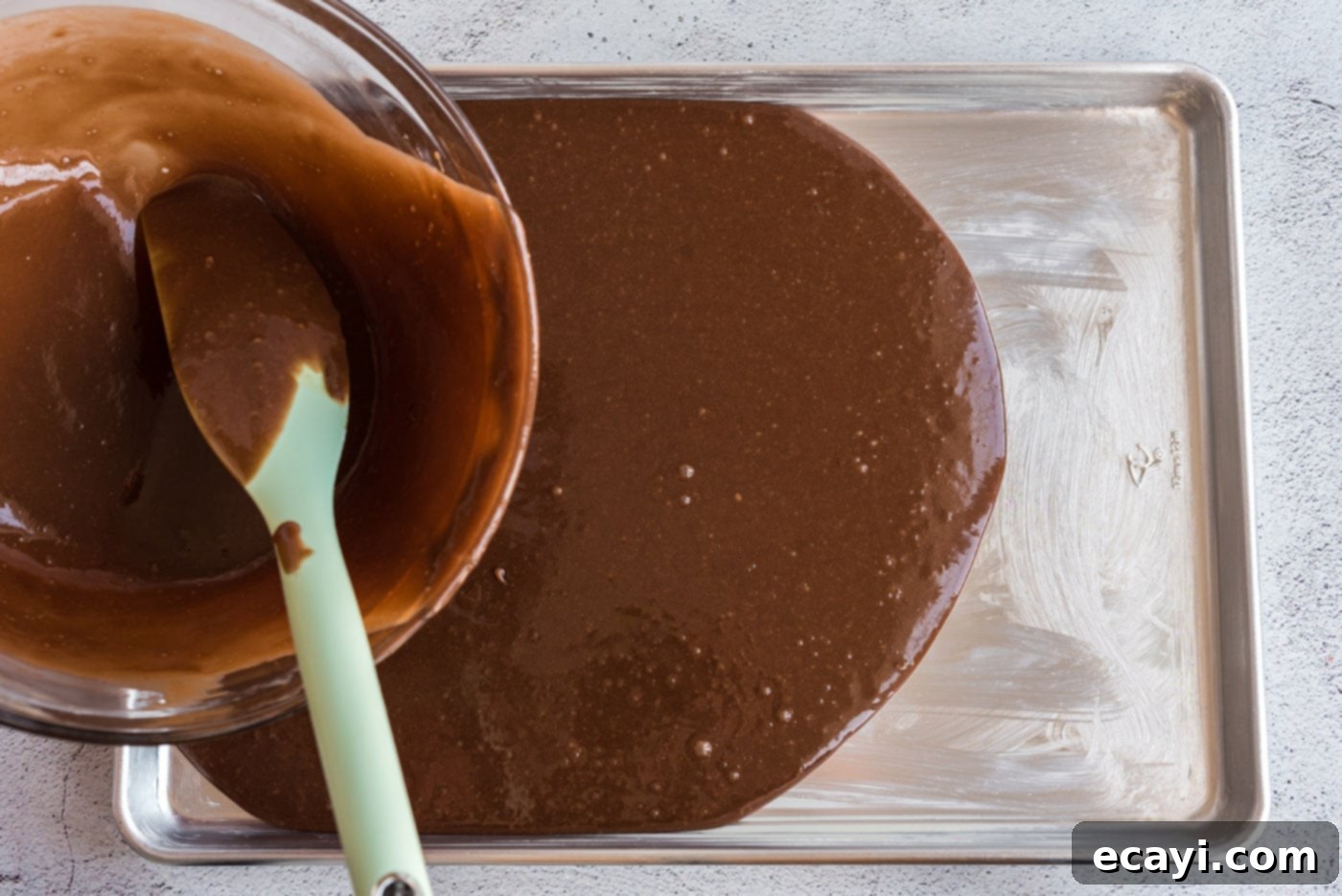 Texas-Sized Chocolate Dream 11 pouring chocolate sheet cake batter into a pan