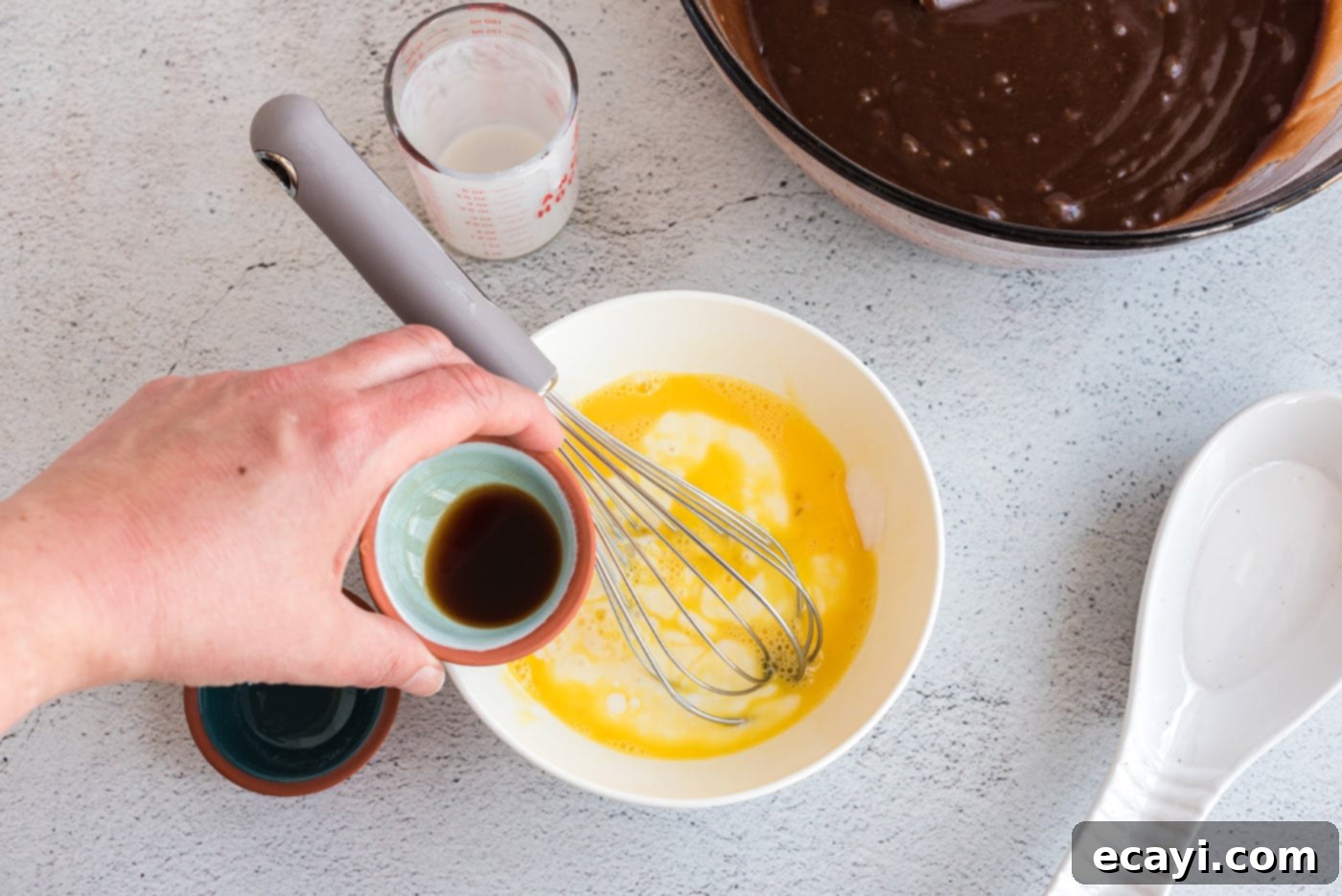 Texas-Sized Chocolate Dream 9 buttermilk, egg, baking soda, and vanilla in a bowl with a whisk