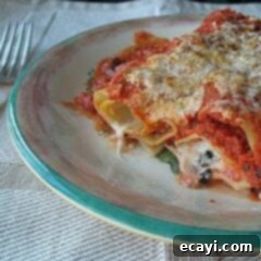 Prosciutto Manicotti Bake 2 A close up photo of a serving of baked manicotti with prosciutto on a plate.