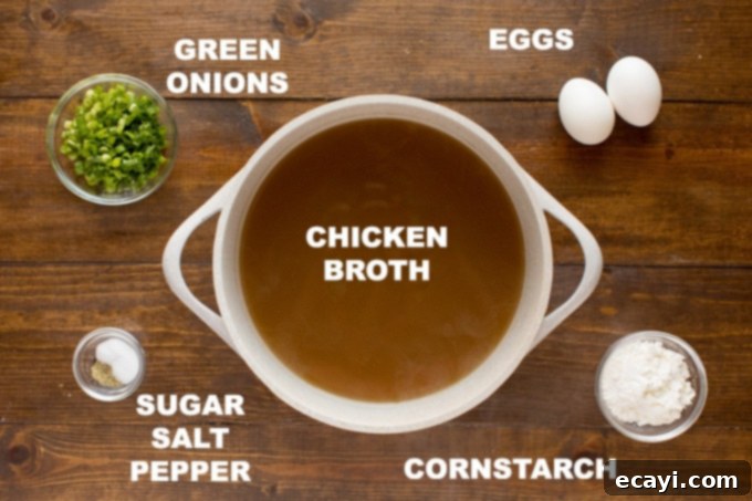 Simple ingredients for an authentic homemade Egg Drop Soup, perfect for a fast meal. fresh ingredients laid out for making quick and easy egg drop soup at home