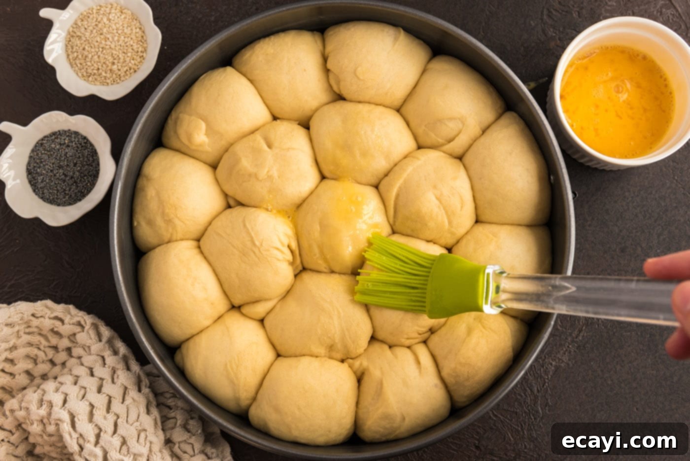 Hearty German Party Loaf 20 brushing dough balls with butter