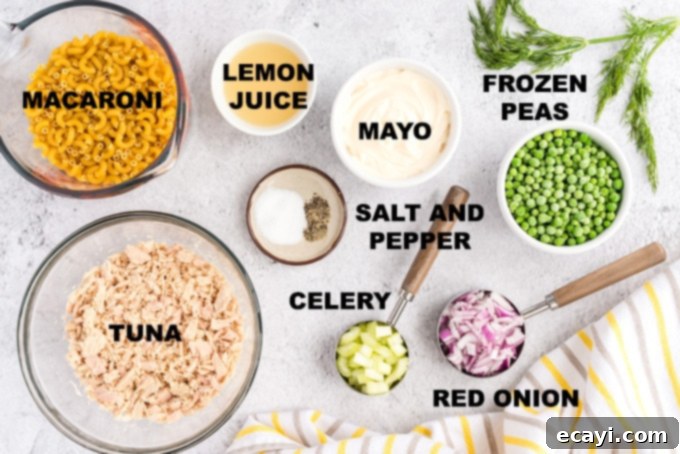 Mediterranean Tuna Pasta 2 ingredients for tuna macaroni salad laid out on a counter