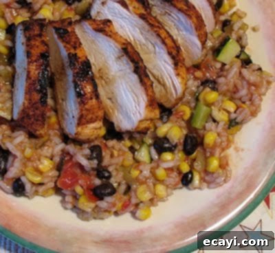 Chipotle Baja Grilled Chicken Platter 3 A close-up of the seasoned and grilled Baja chicken with black beans and rice