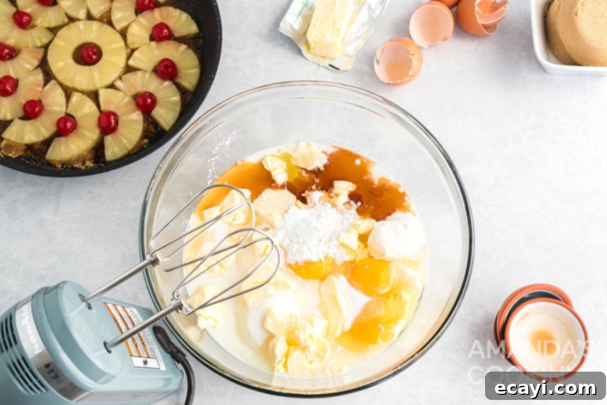 Golden Skillet Pineapple Flip 6 all pineapple upside down cake batter ingredients in a large mixing bowl