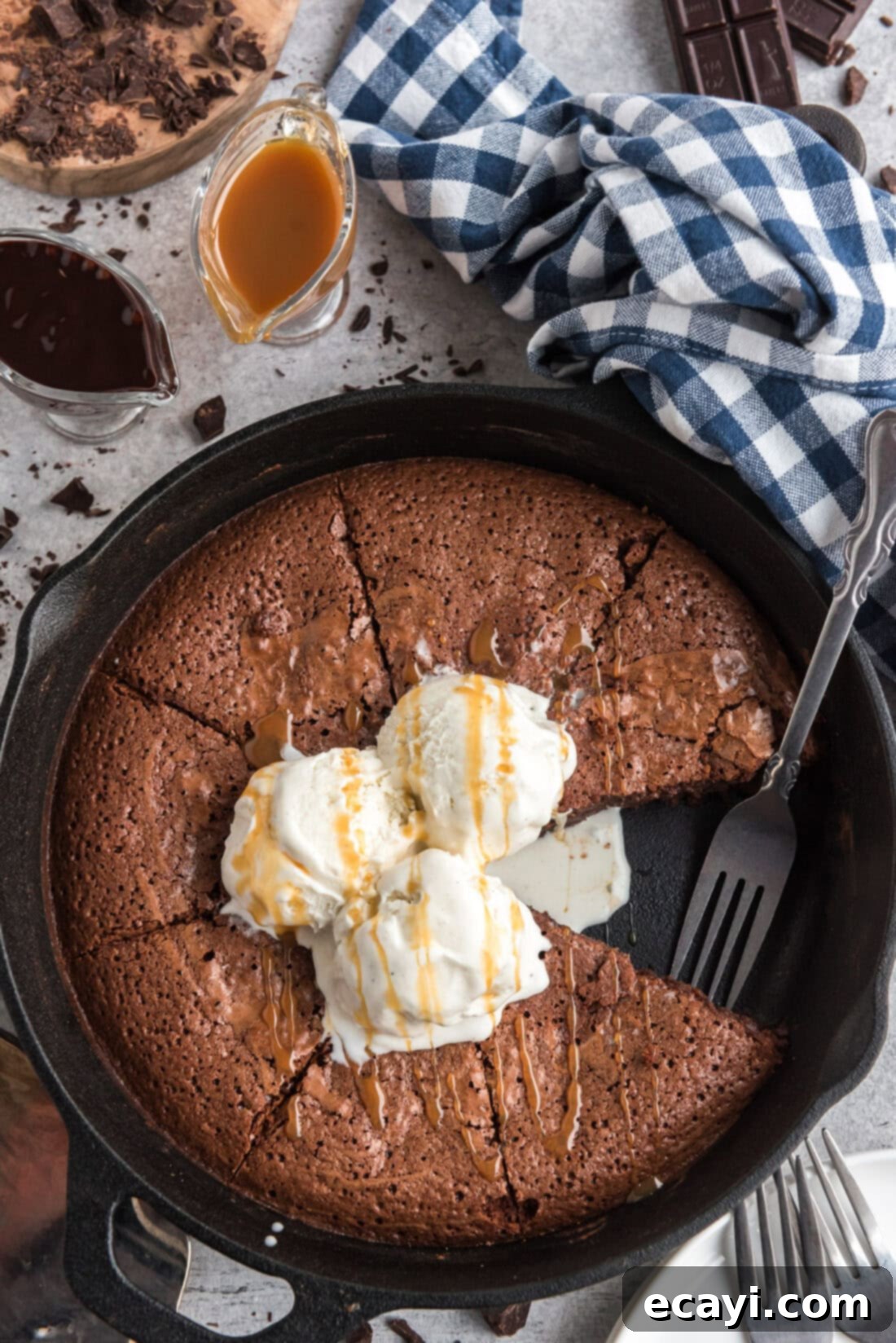 Cast Iron Chocolate Dream 2 Brownies in a Cast Iron Skillet with a slice removed and a fork resting in the pan