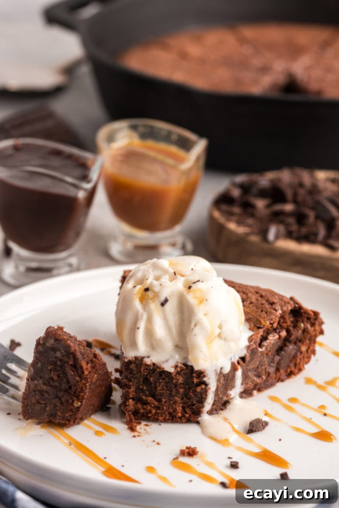Cast Iron Chocolate Dream 3 Slice of Cast Iron Skillet brownies on a plate with ice cream on top