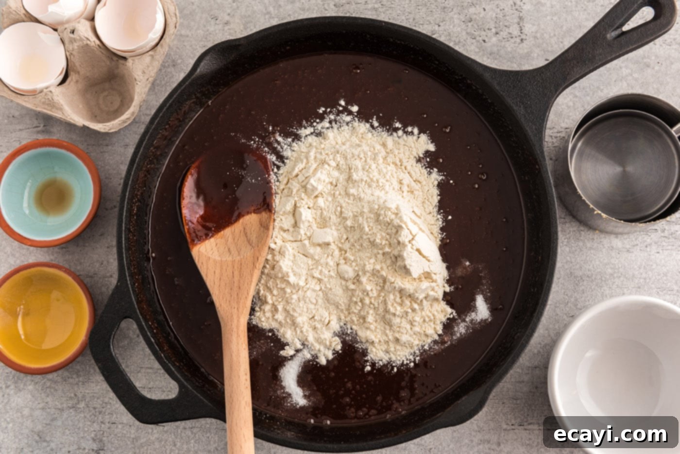Cast Iron Chocolate Dream 8 flour on top of chocolate brownie mixture in a skillet