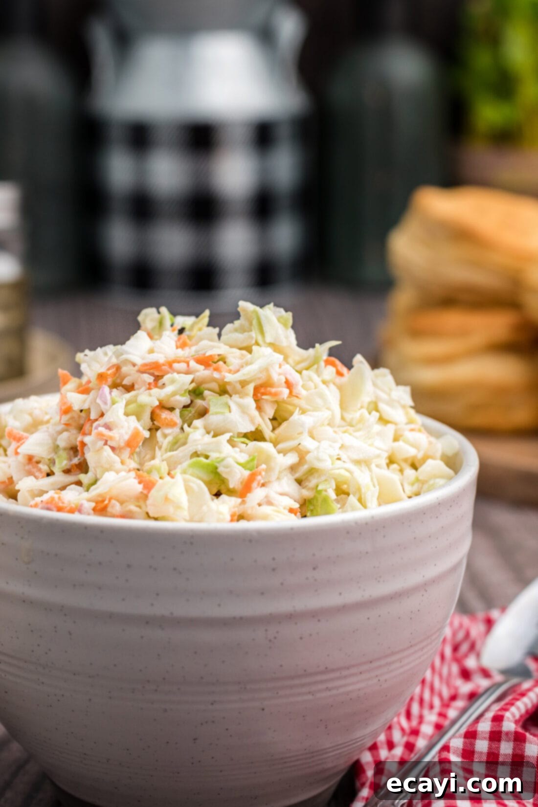 This copycat KFC coleslaw recipe is delicious! You won't be able to tell the difference. This coleslaw recipe is the perfect gathering or potluck dish! #kfccoleslawrecipe #kfccoleslaw #kfccoleslawrecipecopycat #coleslawrecipe #restaurantrecipes #copycatrecipes #potluckrecipes #summerrecipes #bbqrecipes #barbecuerecipes #amandascookin A bowl of freshly made KFC copycat coleslaw, ready to be chilled and served.